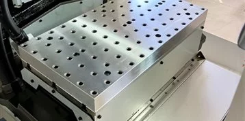 Customized grid plate for machine table